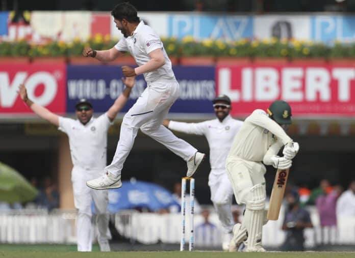India's Umesh Yadav leaps in the air to celebrate the dismissal of South Africa's Quinton de Kock, right, during the third day of third and last cricket test match between India and South Africa in Ranchi, India, Monday, Oct. 21, 2019.