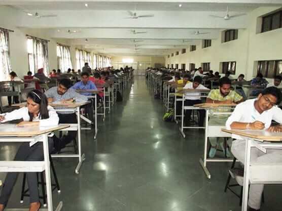 Students in an exam hall taking JEE-NEET exams, academics write to Modi in support.
