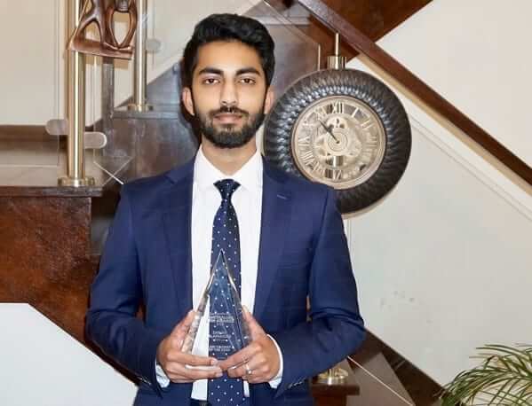 Sanjay Alapakkam, poses with his Lawyer's Weekly Award.