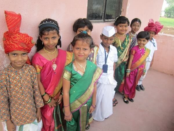 Gyanankur students stabnd in line, all dressed up for a school event