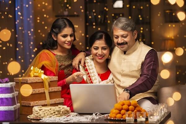 indian family looking at a laptop