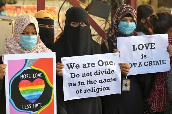 Activist protest against ‘love jihad’ laws being proposed in India.