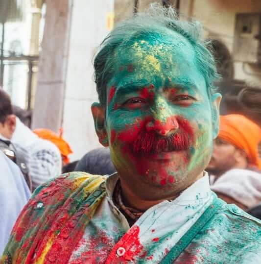 man with gulal colours