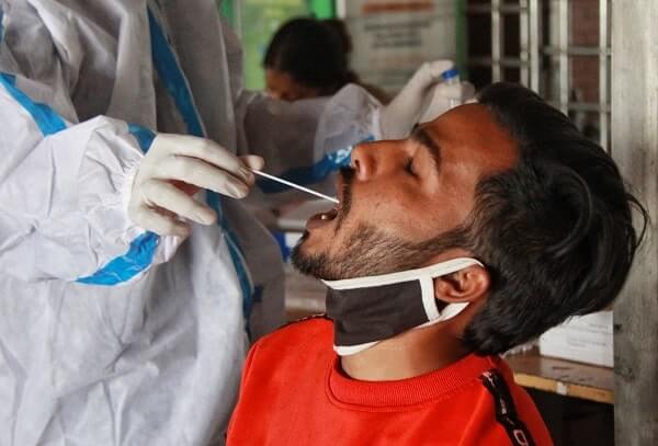 Man gets a covid test in India