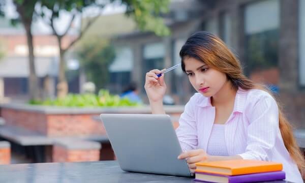female international student with laptop