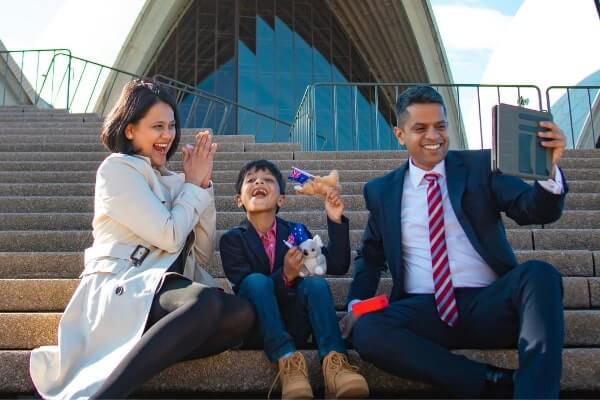 The Neelamraju family at their citizenship ceremony: It was virtual, but they went made the video call on the steps of the Sydney Opera House to make it a memorable moment. Image supplied