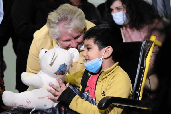 Boy holding teddy bear