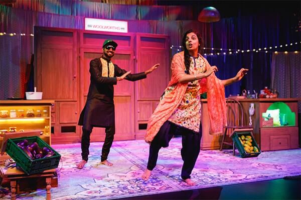 Sukhjit and Pawan Kumar dance on stage for the Perth production of 'Fully Sikh'