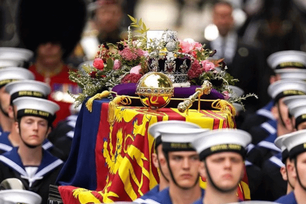The Imperial State Crown and the Sovereign’s Orb and Sceptre on the coffin of Queen Elizabeth II for her funeral at Westminster Abbey, London in 2022