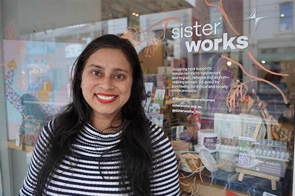 Poonam Jeet Sokhi stands in front of the Richmond Sisterworks Crafted Culture cafe.