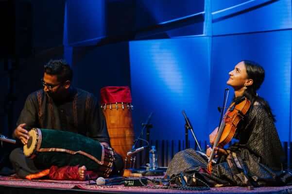 Bhairavi looks up at the roof, whilst Nanthesh plays his mridangam at their concert in the Melbourne Recital Centre.