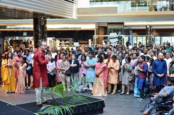 Attendees crowd around stage at ANZ Banking Group's 2023 Diwali fundraiser.