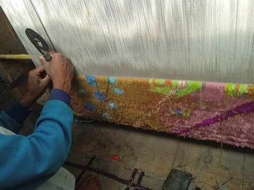 A Kashmiri weaver at work