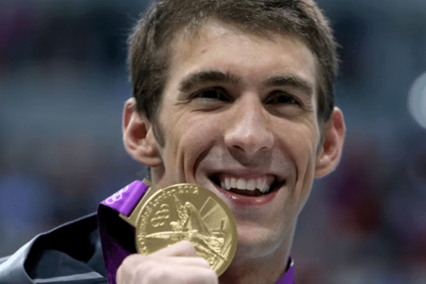 Photo of Michael Phelps holding a medal