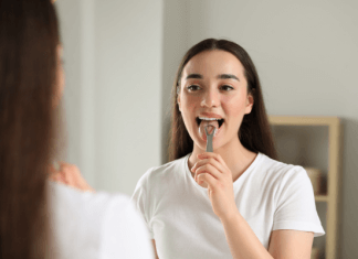 Image of woman brushing her teeth