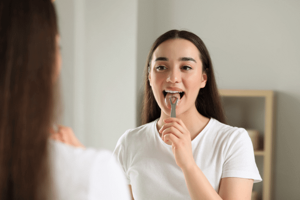 Image of woman brushing her teeth