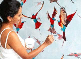 Priya Gore painting her birds