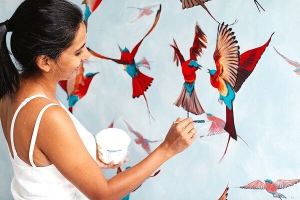 Priya Gore painting her birds