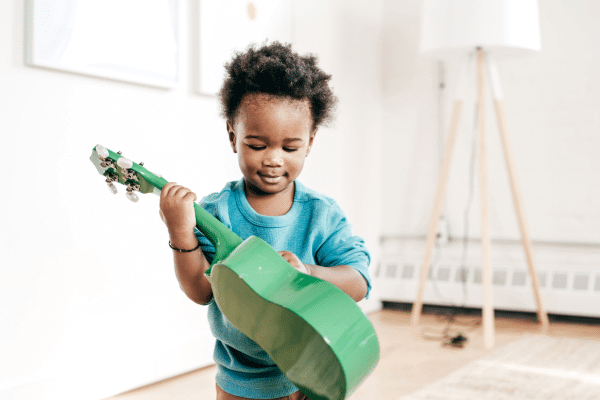 Photo of a child learning music