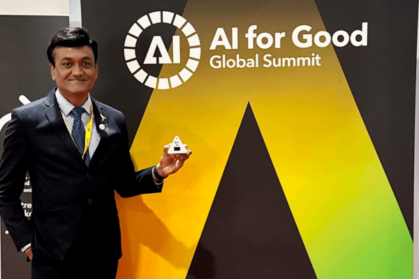 Dr Kiran Trivedi shows off his invention at the UN's AI For Good Summit earlier this year. (Source; Supplied)