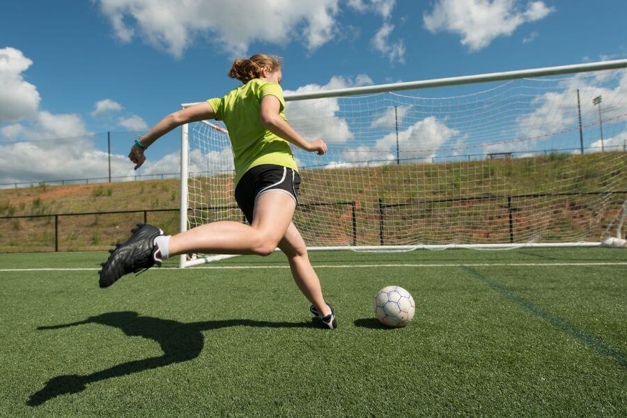 woman playing soccer